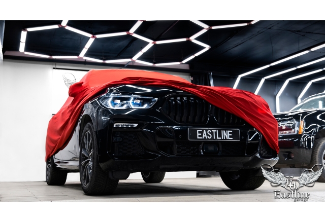 BMW X6 – пошив красного защитного чехла в Eastline Garage 
